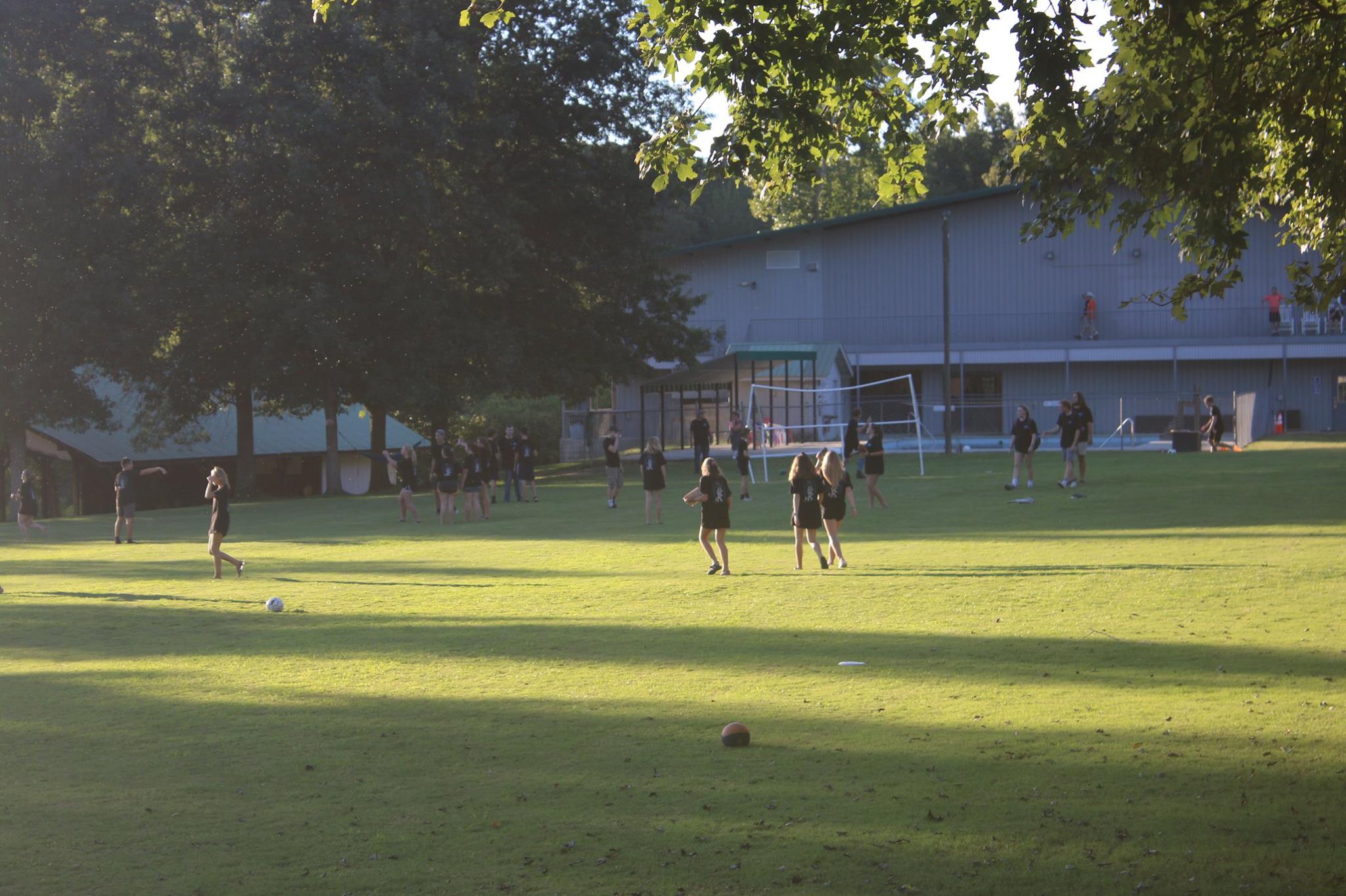 campers playing on soccer field